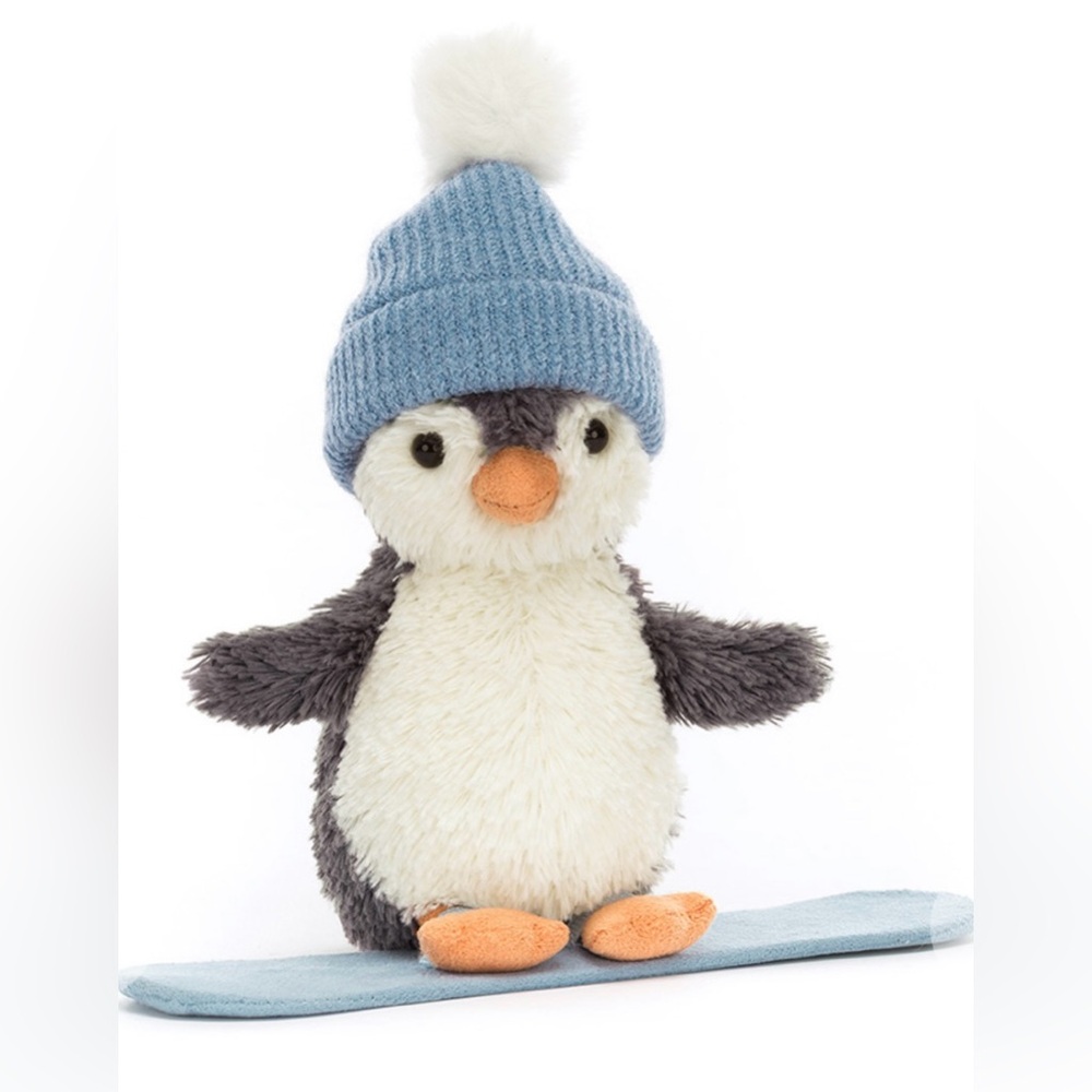 Authentic Jellycat snowboarding penguin with tags and dust bag